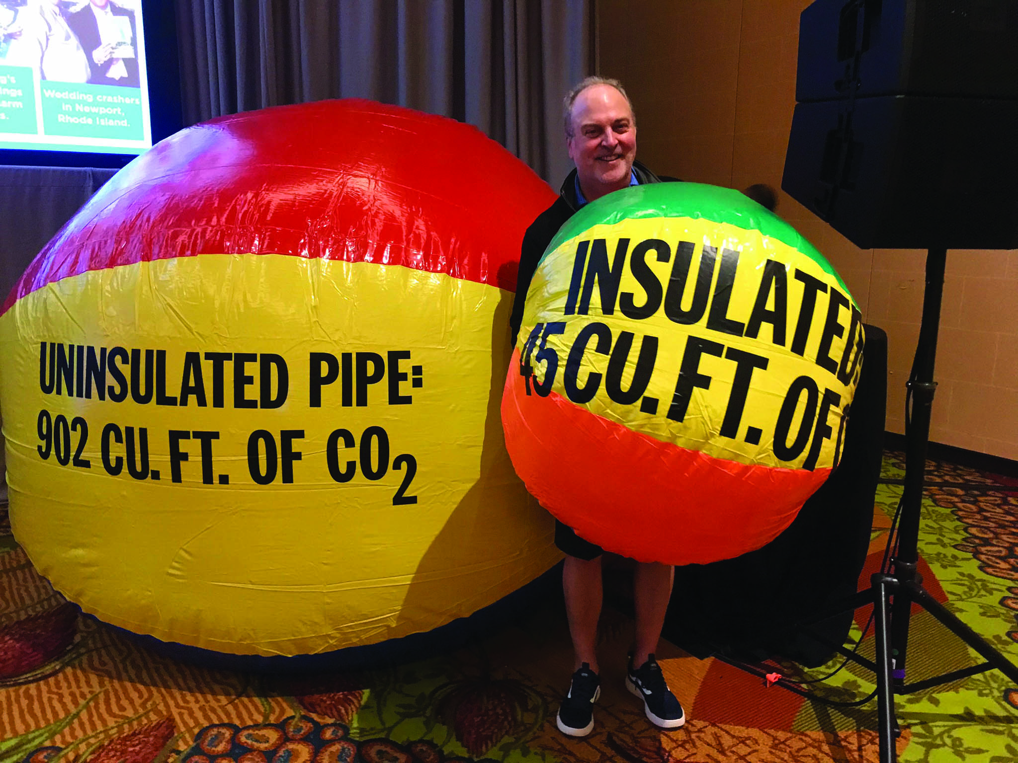 NIA President Dave Cox demostrates how insulation reduces CO2